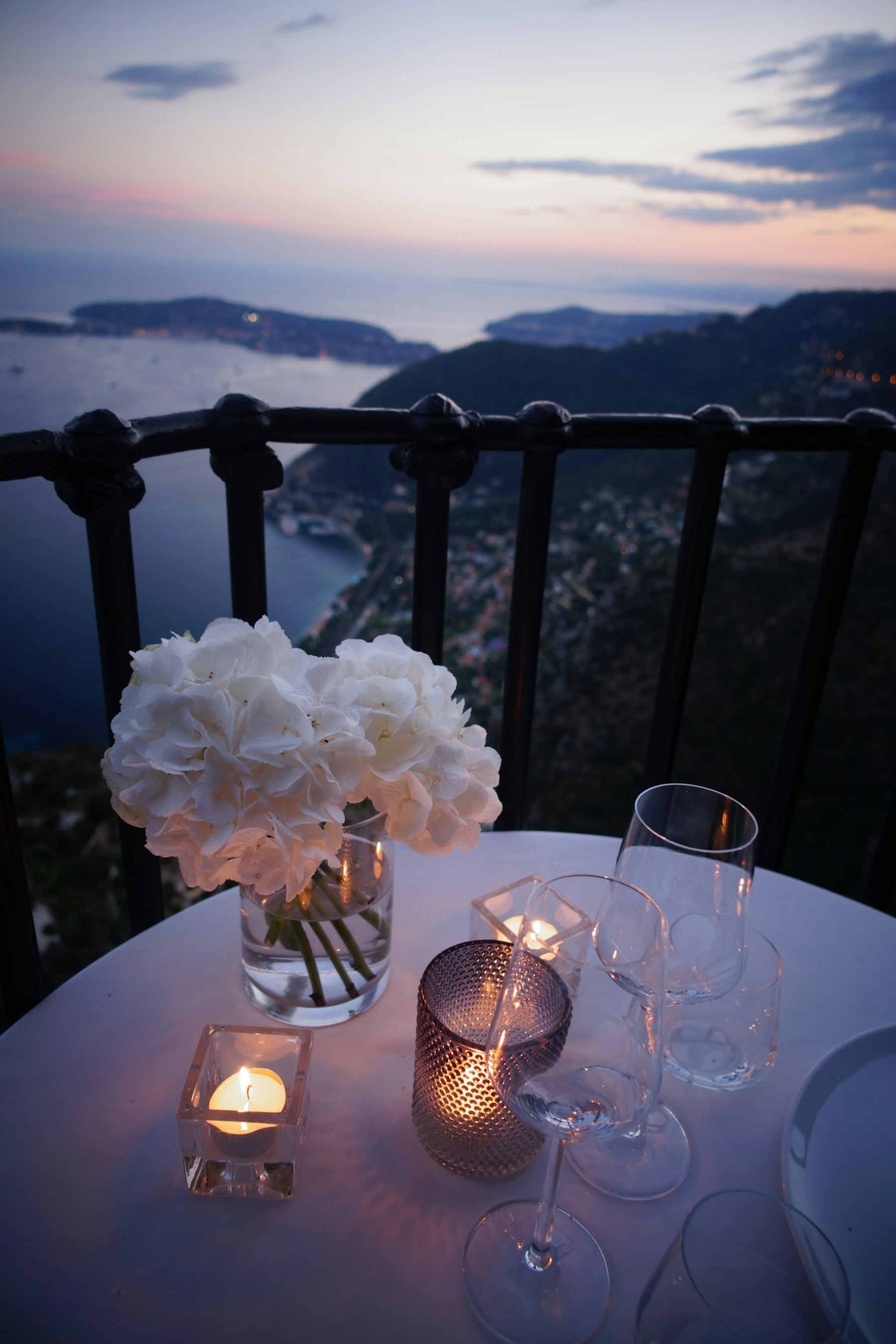 Candlelit terrace table overlooking the sea at House Kitchen & Bar